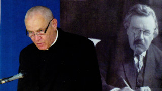 Fr. Ian Boyd with Chesterton banner