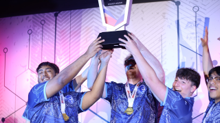 2024 Rocket League team holding up the BIG EAST Championship trophy