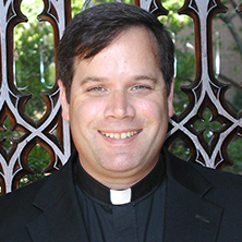 Fr. Douglas Milewski posing