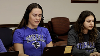 A photo of Seton Hall students working in the Digital Engagement Center.
