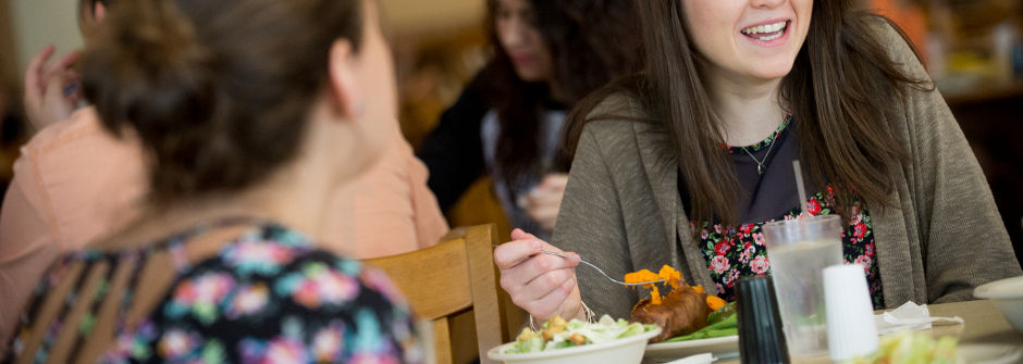 Students dining together in the cafeteria. 