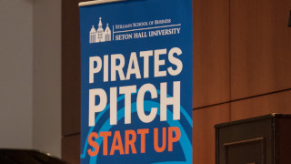 A photo of the Pirates Pitch Startup banner.