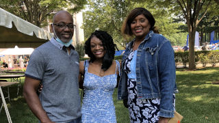 Victoria Duncan standing with her parents