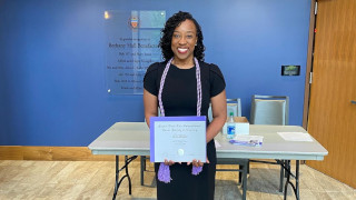 320 Nikia Sharp - Project Height award a photo of Nikia Sharp receiving the Project Height award