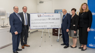 a photo of Dean Brian Shulman, President Joseph Nyre, Congressman Bill Pascrell, Dean Marie Foley and Coordinator of Clinical Skills Lab Kathy Sanok celebrating $1.1 million federal investment