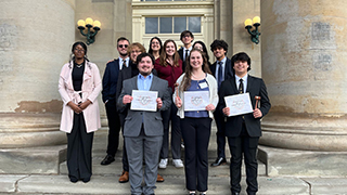 Students with awards at Georgetown ConferenceSHUNA with awards at Colombia University ConferenceSHUNA Team with awards at Cornell University