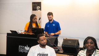 Image of CCRE Director Timothy Hoffman and high school students during Seton Hall's Be the Change conference