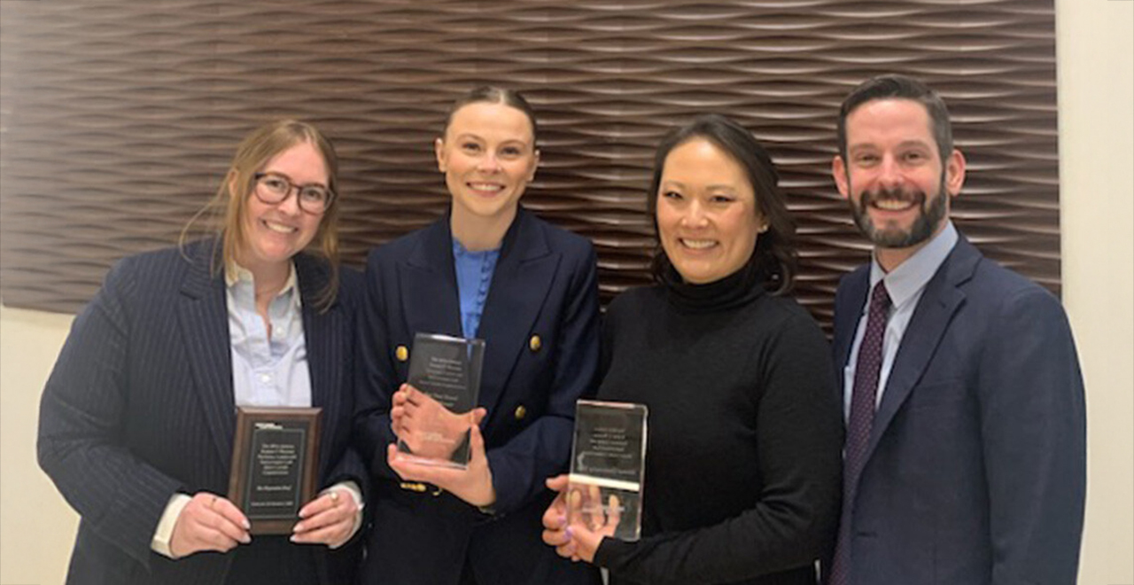 Seton Hall Law 3Ls Shea Moran and Emme Anderson pose with their awards for winning the Robert F. Wagner National Labor and Employment Law Moot Court Competition.