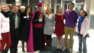 42081389_archbishopmyersphoto with students 320 Archbishop Myers