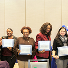 Awardees gather to show off their certificates recognizing their more than 10 years of service to the University.