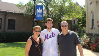 Bobby Steiner standing with his parents
