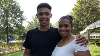 Jedier Hernandez standing with his mother