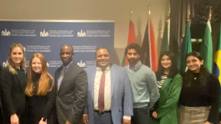 Admiral Hayes Posing with Ahmad Choudhary and other students