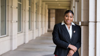 Akaysha Palmer 320 Akaysha Palmer wearing a black blazer outside the Walsh Library.