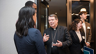 Archbishop Christophe Pierre is shown in conversation as part of the World Leaders Forum series.