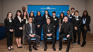 Archbishop Christophe Pierre speaks on stage as part of the World Leaders Forum series.Archbishop Christophe Pierre is shown in conversation as part of the World Leaders Forum series.Archbishop Christophe Pierre pictured with a group of diplomacy and international relations students and representatives as part of the World Leaders Forum series.