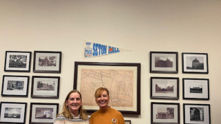 a photo of two ladies inside an office 