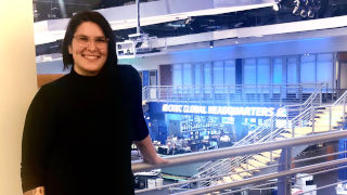 Ashley Turner standing in a news studio