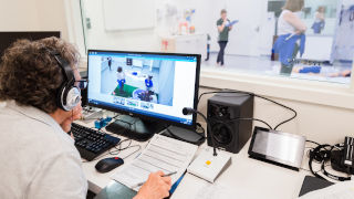 Athletic Trainers examining skeletonTrainers assessing athleteStudent examining other athletic trainers