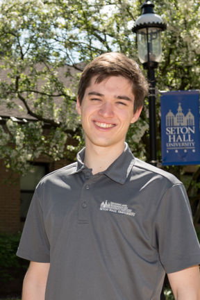 Male student in grey shirt