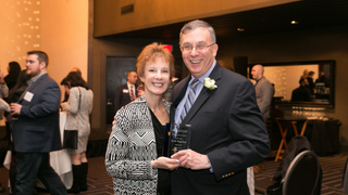 Alumnus Bernie Wagenblast uses the skills he learned to help WSOU and St. Michael Church in Cranford.On assignment for WSOU, Bernie Wagenblast joined Seton Hall’s ROTC unit to provide a first-hand account of military training.Bernie Wagenblast with his wife, Joy, after accepting a Seton Hall Distinguished Alumni Award. 