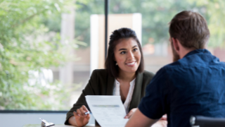 Picture of a businesswoman meeting with a client. 