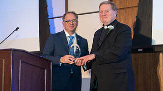 Photo of Cardinal Joseph W. Tobin receiving his award at the Unanue Gala 2022