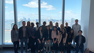 Photo of students, Career Center staff, and Caleb Barnhart, a Seton Hall alum and a senior vice president at Sloane &amp; Company, at the PR firm’s World Trade Center office in New York City.