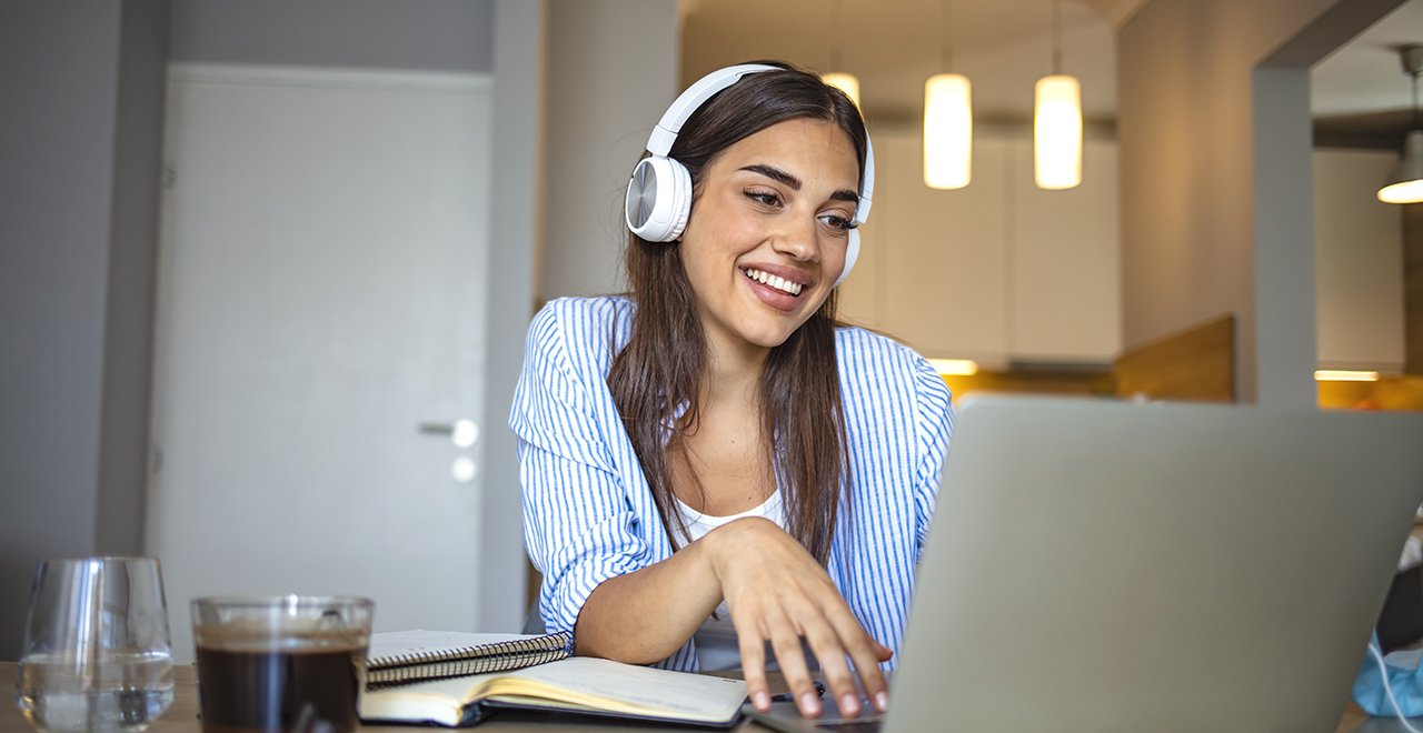 A Young Lady Chatting on a Laptop