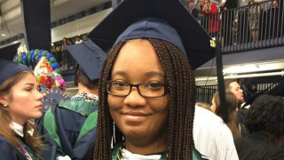 Kristina Simmonds, Online Counseling Student in a cap and gown. 