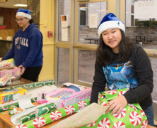 Young female wrapping a gift