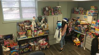 DOVE sorting toys for Christmas in October.