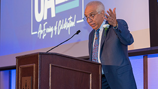 Photo of Dr. Ramon Tallaj receiving his award at the Unanue Gala 2022