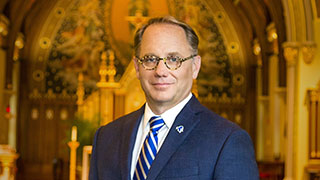 Dr. Nyre photographed in the Chapel at Seton Hall