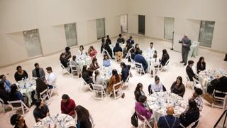 Image of students sitting at tables for the 2022 Career Center etiquette dinner 