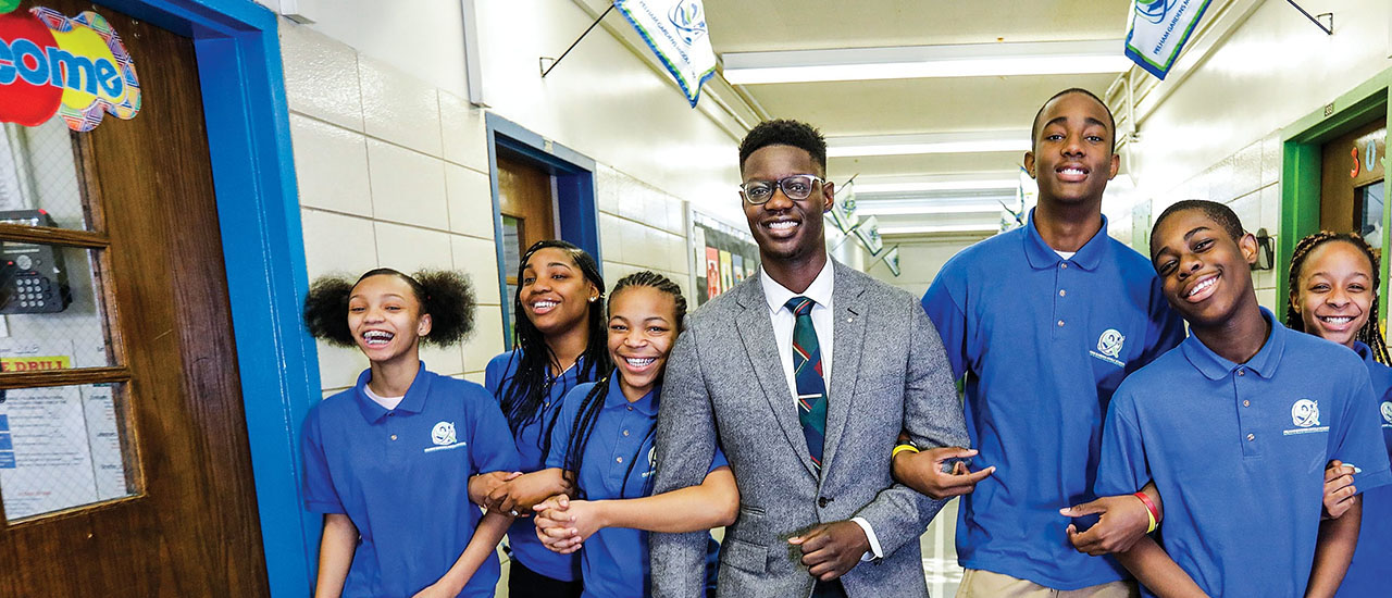 Edmund Adjapony with students. 