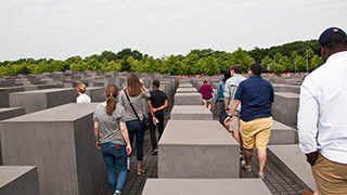 Group of people on a tour.Fellowships at Auschwitz for the Study of Professional Ethics (FASPE) round-table discussion.Group of tourists at the Holocaust Memorial.