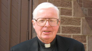 Luna Kaufman with her bookPhoto of Father John Morley