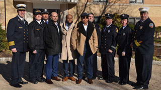 Vice President of Student Services Shawna Cooper-Gibson, Alvaro Llanos, Shawn Simons, and U.S. Representative Bill Pascrell, Jr.Alvaro Llanos and Shawn Simons Kneeling in front of the Boland Hall MemorialFire Safety Professionals with Boland Fire Survivors