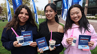 Giving Day flages on the University Green