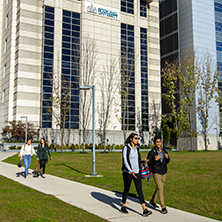 Students Walking in front of the IHS building.