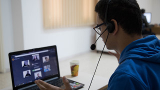 Young person using Soliya on a laptop. 