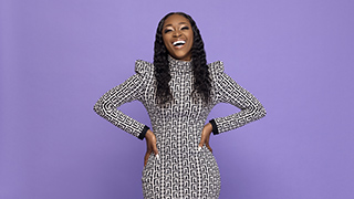 Picture of Jodiann Morgan laughing with hands on her hips.