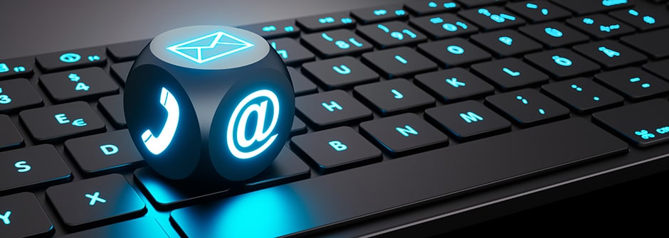 Lightning dice with communication symbols on illuminated black keyboard