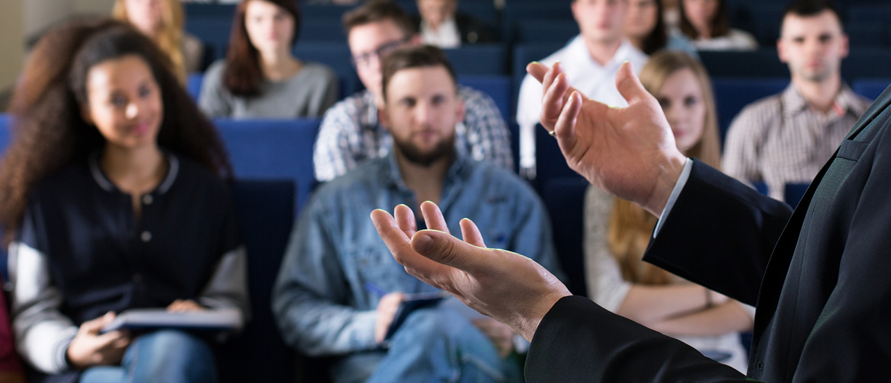 Man giving a lecture to an audience