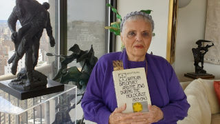Luna Kaufman with her book