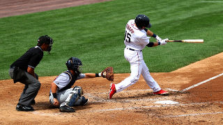 Photo of a baseball player swinging a bat