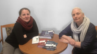 A photo of buildings and treesMary Balkun and Marta Deyrup