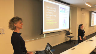 Medicine 320 Veronique Dartois, left, presents at the IHS IPE Research Seminar Series on Jan. 24.