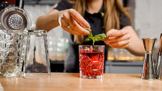 Mixologist making a drink. 